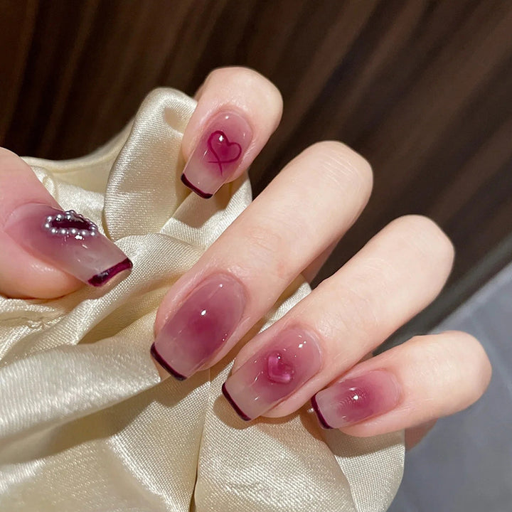 Blush ice-painted heart-shaped nail art