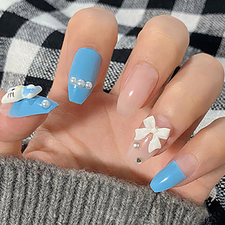 Cute cat wearing a stylish blue manicure