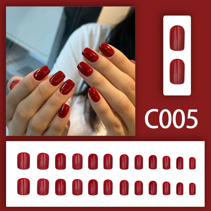 Pure red-toned attire with nail polish