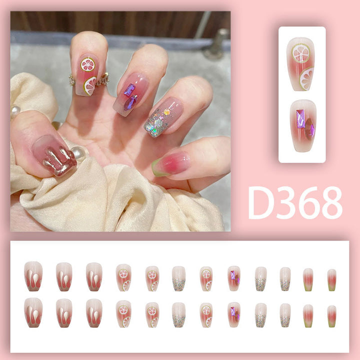 Shiny diamond fragments and fresh lemon nail polish