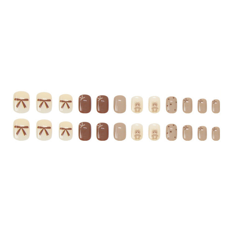 Coffee bow tie teddy bear wearing nail polish