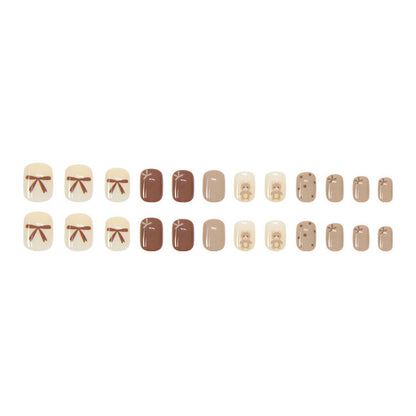 Coffee bow tie teddy bear wearing nail polish