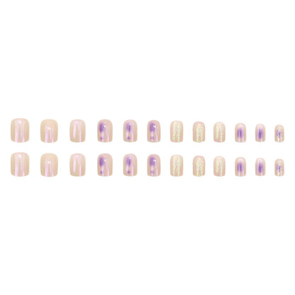 Glitter sprinkled on purple spots for nail decoration