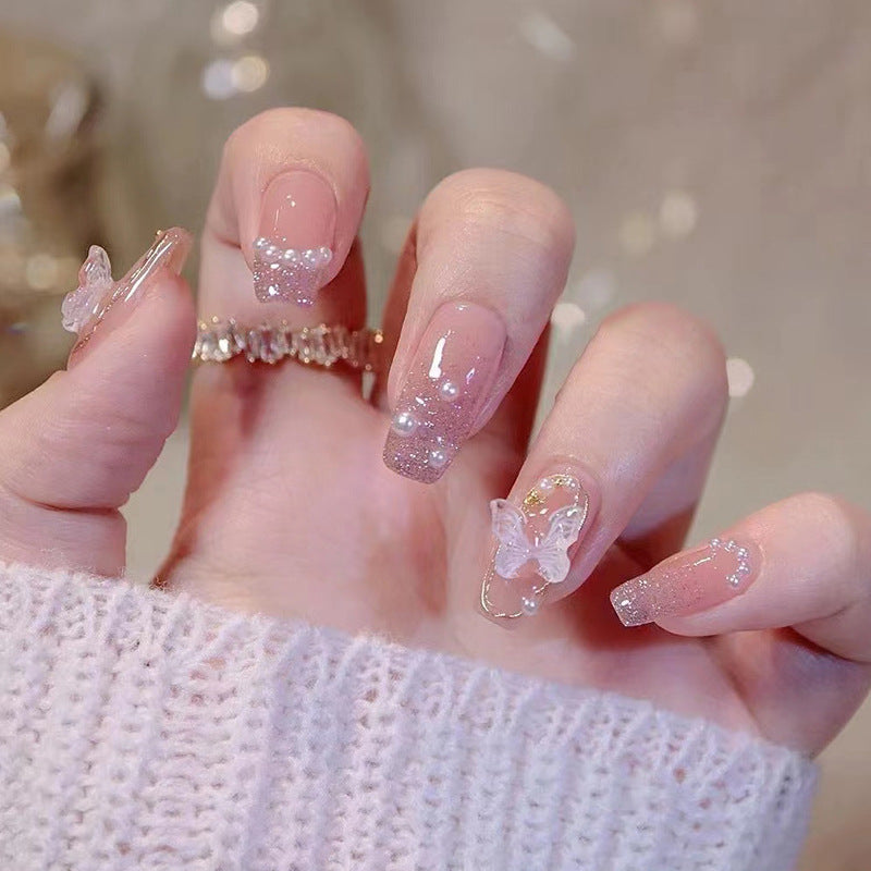 Elegant purple luxury style butterfly and pearl manicure