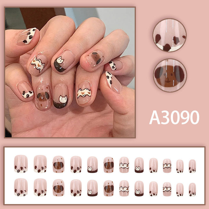 Cute spotted dog wearing nail polish