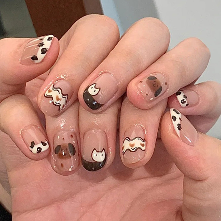 Cute spotted dog wearing nail polish