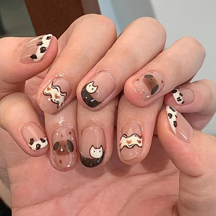 Cute spotted dog wearing nail polish