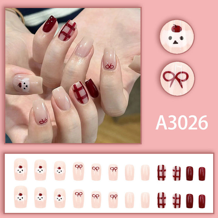 Cherry-dog style, red checkered outfit, adorned with nail polish.
