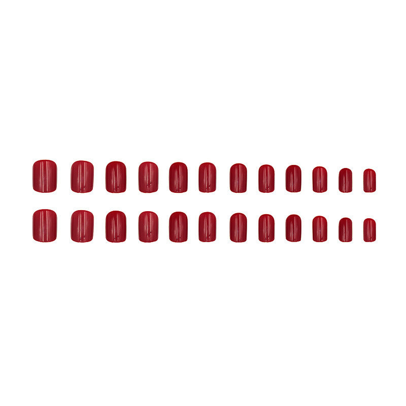 Pure red-toned attire with nail polish