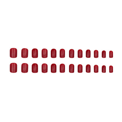 Pure red-toned attire with nail polish