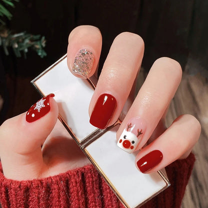 Golden flashing Christmas cartoon deer with painted nails