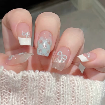 Bows and polka dot cat-eye manicure