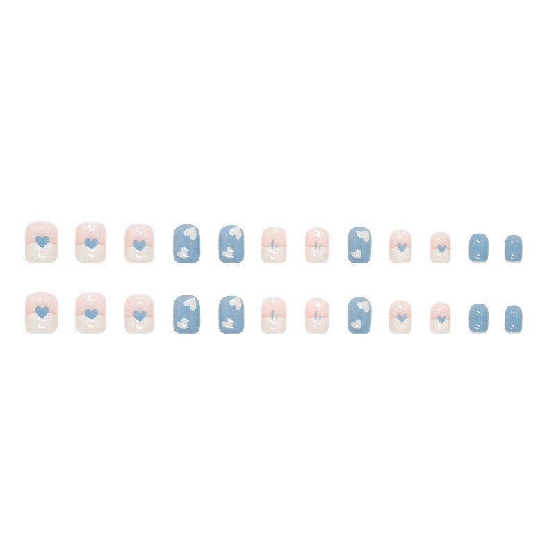 Dark blue and white heart-shaped nail polish