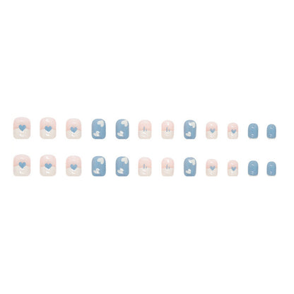 Dark blue and white heart-shaped nail polish