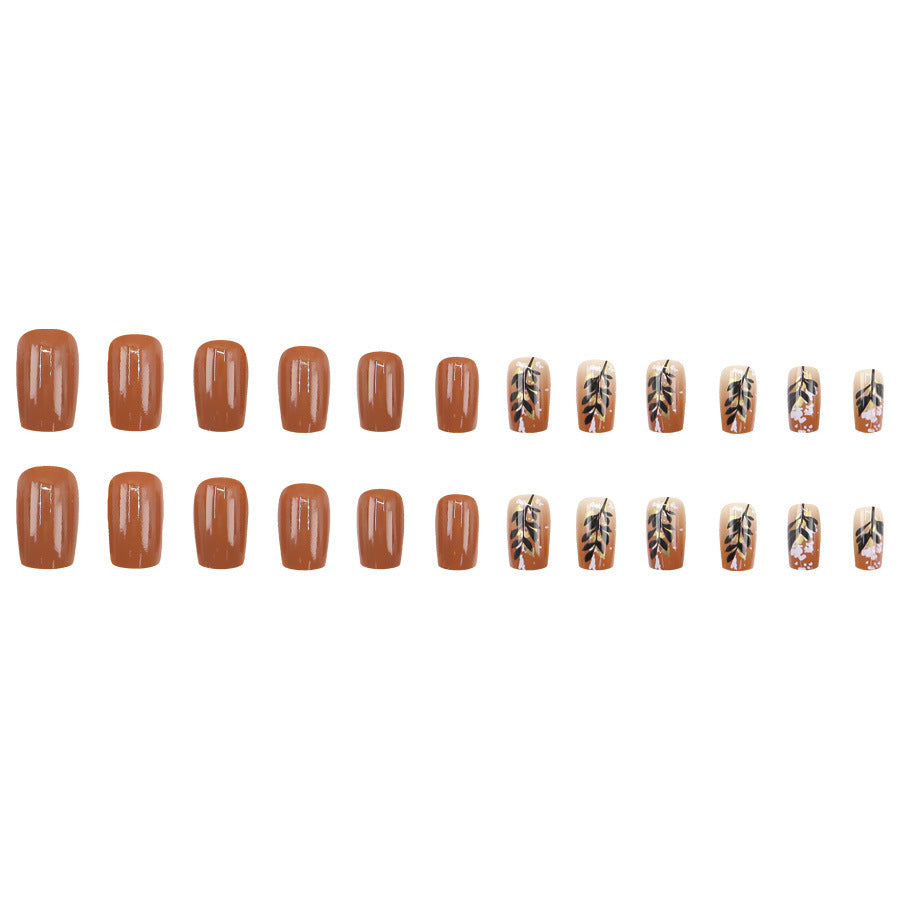 Caramel-colored leaves and gold foil manicure