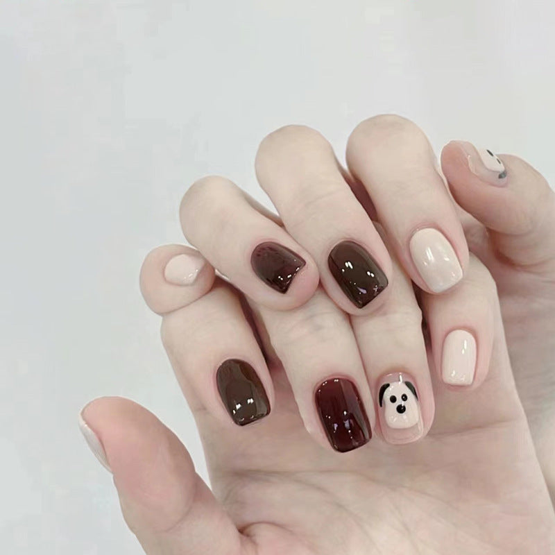The little dog, named Wuxingren, has brown nail polish.