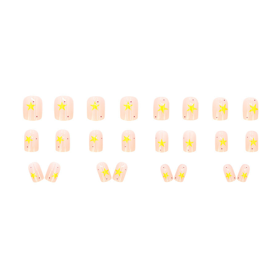 Cream-colored gradient yellow star nail polish