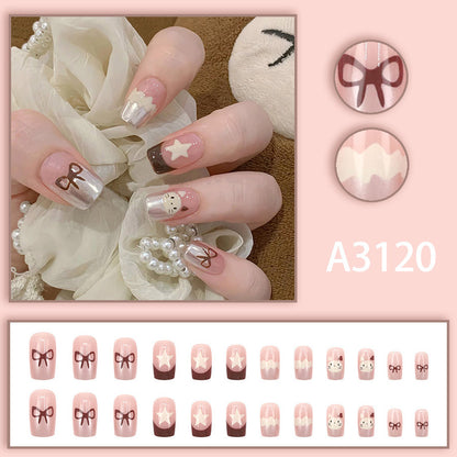 Ice cream cat with a brown bow-shaped nail polish