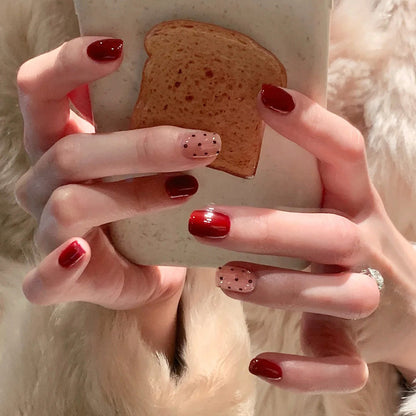 Red polka dot nude pink bow-shaped nail art