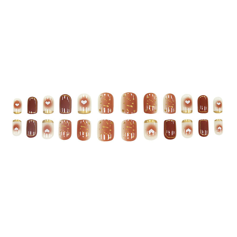 Ins-style nude gradient heart-shaped nail art with a nude gradient design and a heart shape.