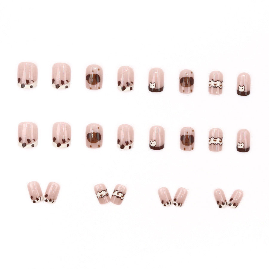 Cute spotted dog wearing nail polish