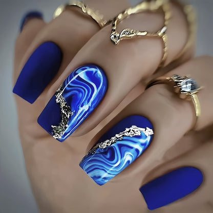 Blue shading with golden stripes on a long-style manicure