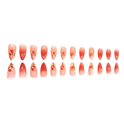 The peach-pink color is gradually applied to the nails.