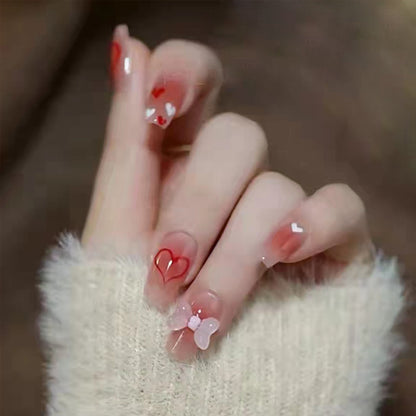 Mid-length pink diamond-style bow nail art