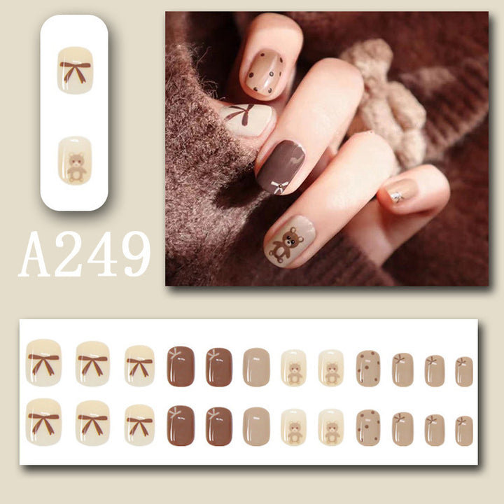 Coffee bow tie teddy bear wearing nail polish
