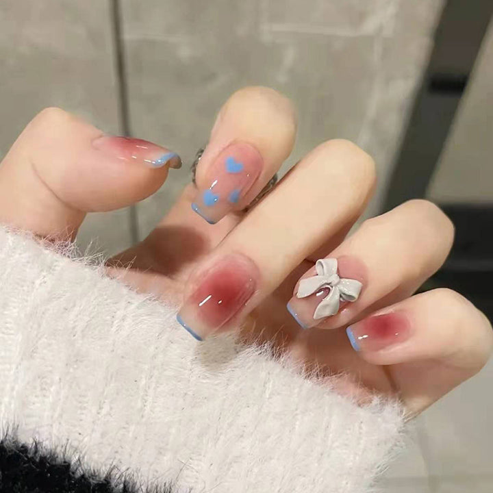 Red knot heart-shaped butterfly nail art