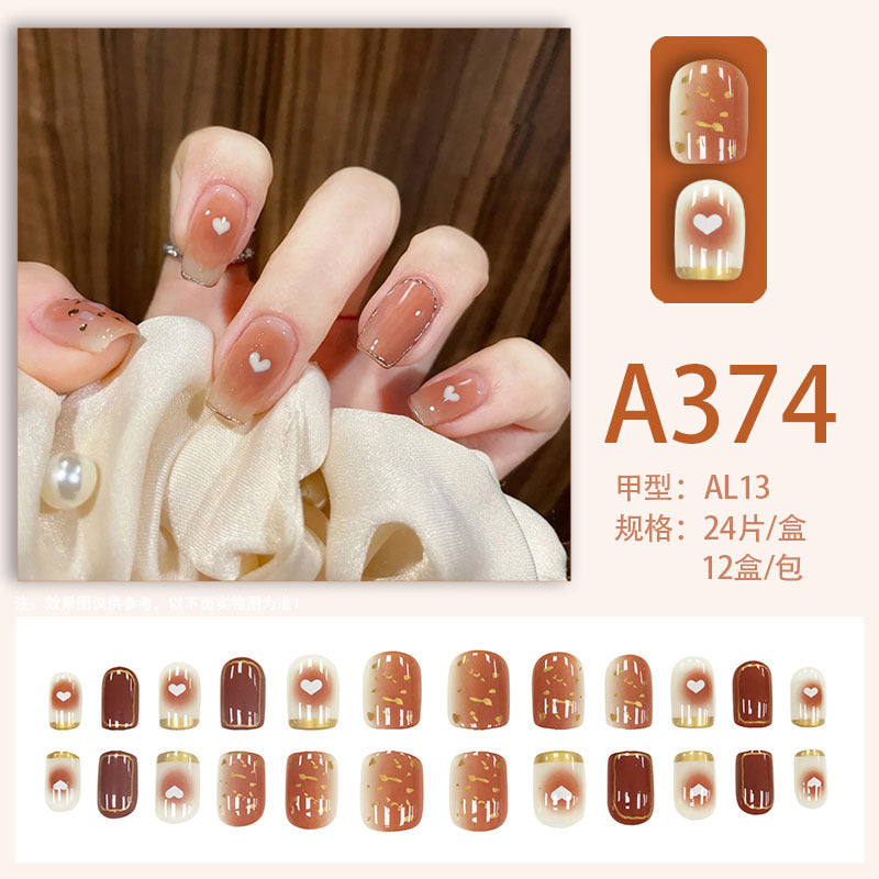 Ins-style nude gradient heart-shaped nail art with a nude gradient design and a heart shape.