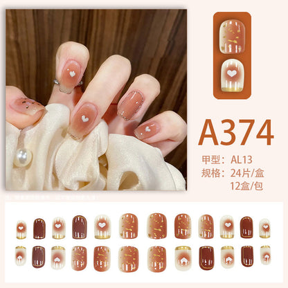Ins-style nude gradient heart-shaped nail art with a nude gradient design and a heart shape.