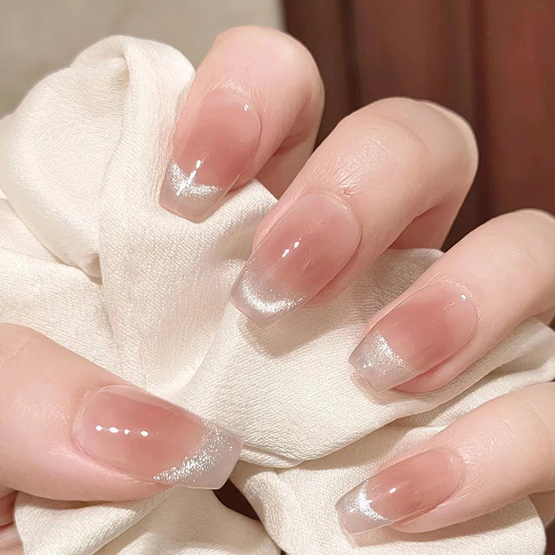 Long manicured nails on the eyes of Smile Cat