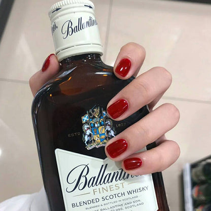 Dark red solid-colored manicure