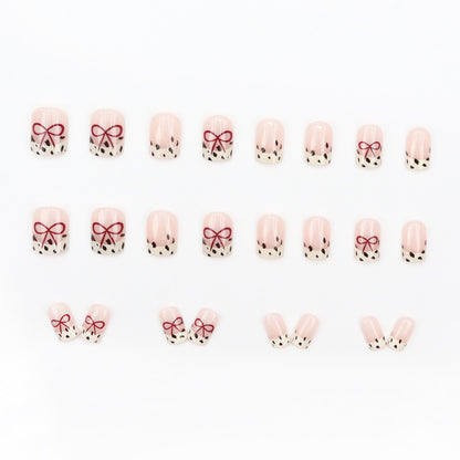Bare color powder bow leopard print nail art