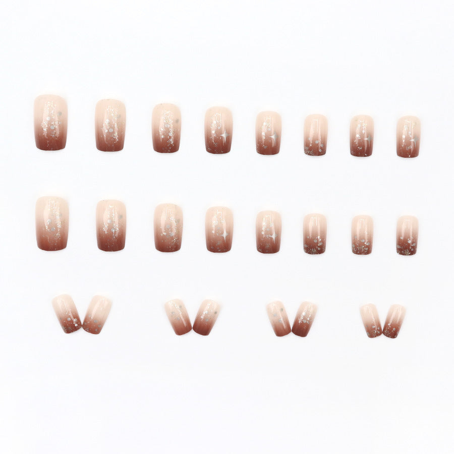 High-end and luxurious aesthetic manicure with a gradient of warm caramel and amber tones, creating a sense of atmosphere.