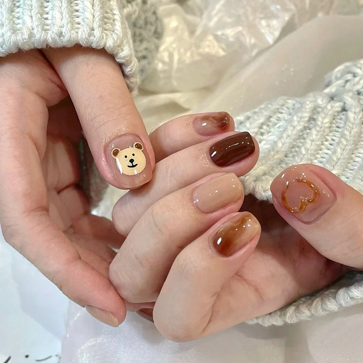 Cute cartoon teddy bear wearing nail polish