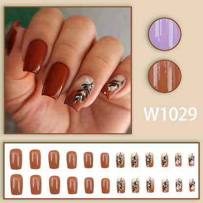 Caramel-colored leaves and gold foil manicure