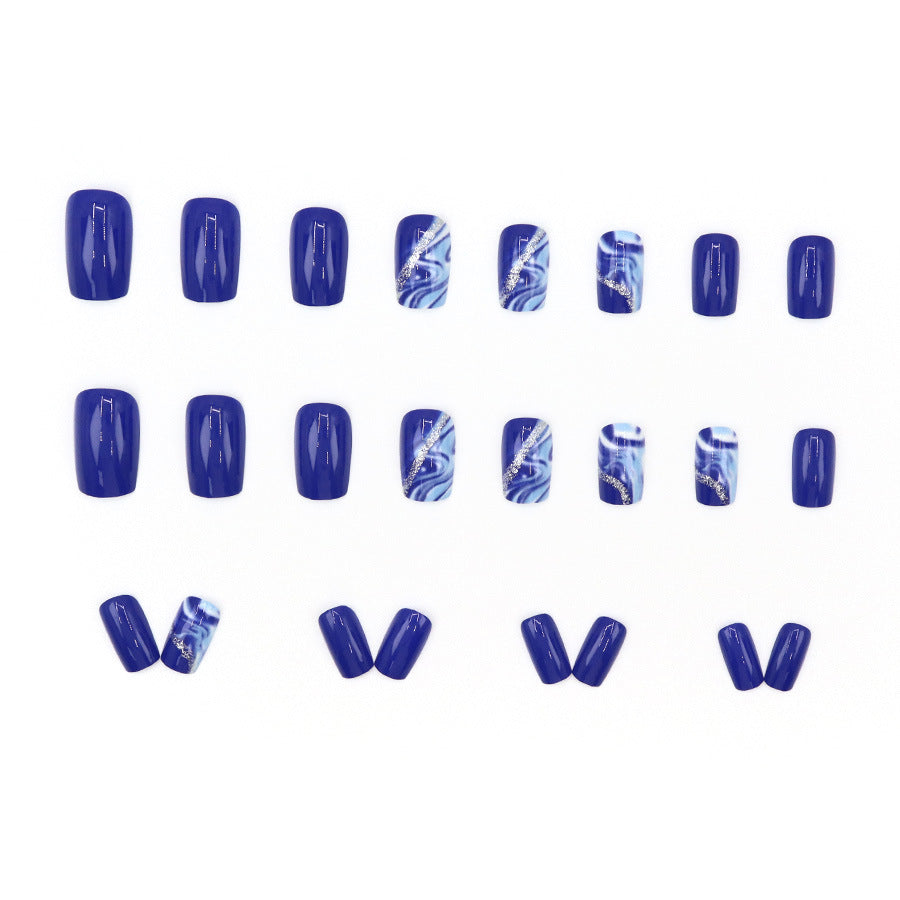 Blue shading with golden stripes on a long-style manicure