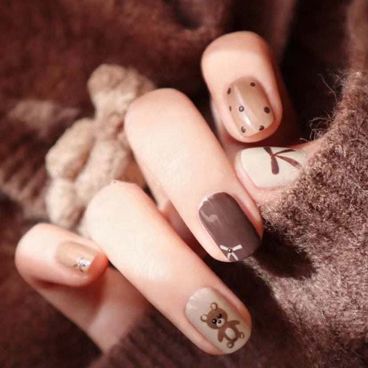 Coffee bow tie teddy bear wearing nail polish