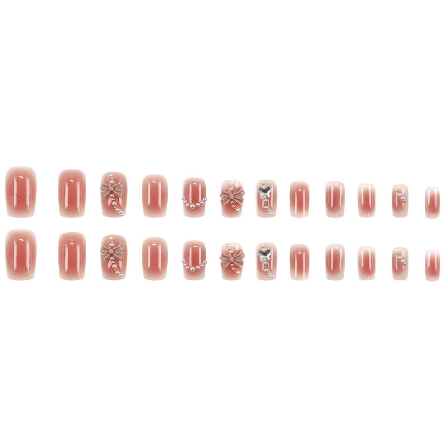 Red bow-shaped pearl manicure