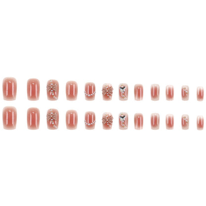 Red bow-shaped pearl manicure