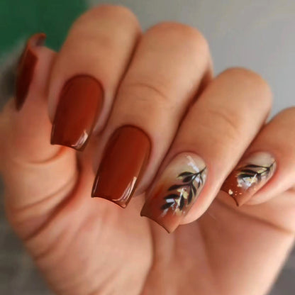 Caramel-colored leaves and gold foil manicure