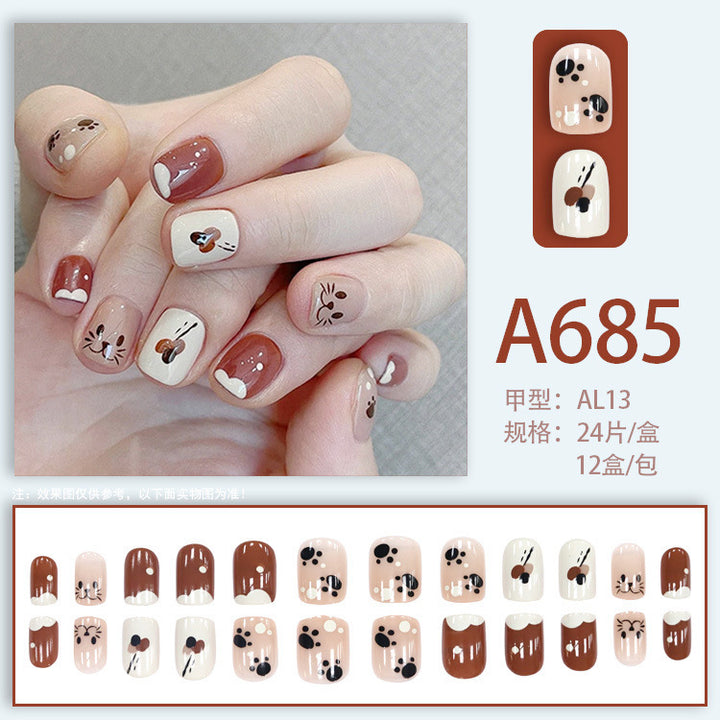 Cute cartoon candy-colored cat paw with nail decorations
