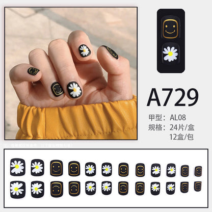 Black-colored small daisy smiling face manicure