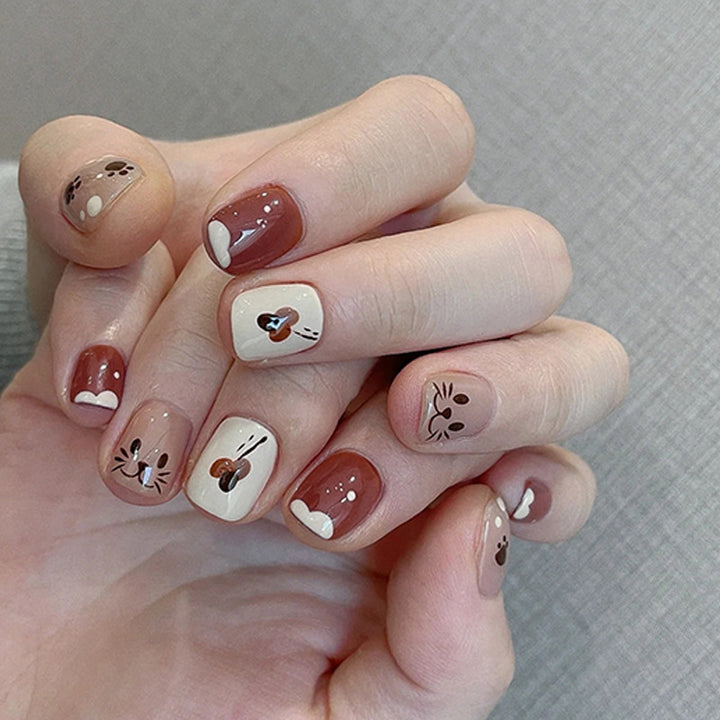 Cute cartoon candy-colored cat paw with nail decorations