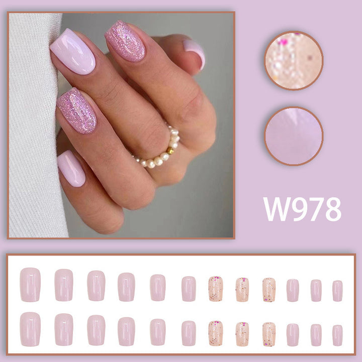 Pink glitter powder applied to nails