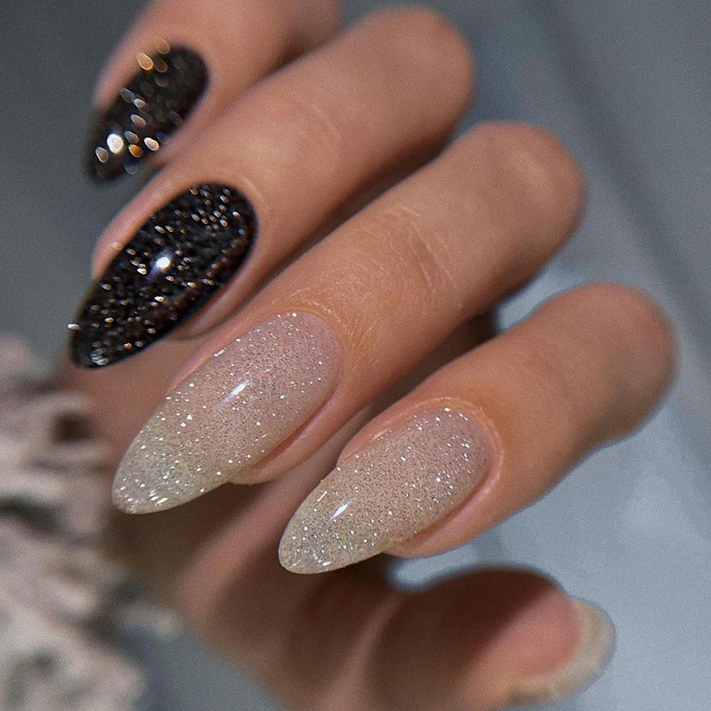Long style almond-shaped nail polish in black and white style inspired by Ins