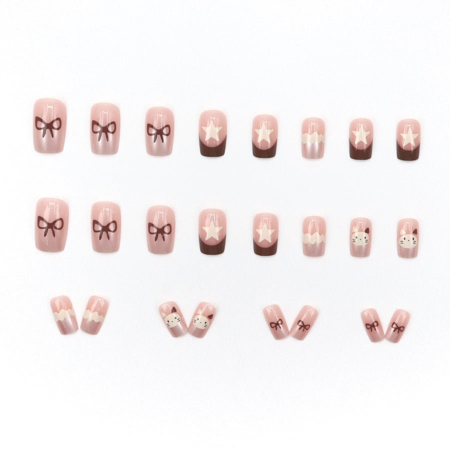 Ice cream cat with a brown bow-shaped nail polish
