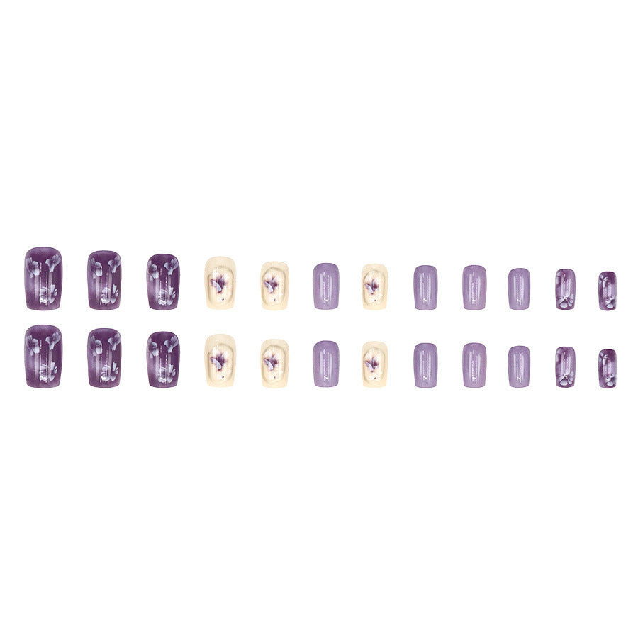 Simple square-shaped nail polish with purple flowers and a beautiful design